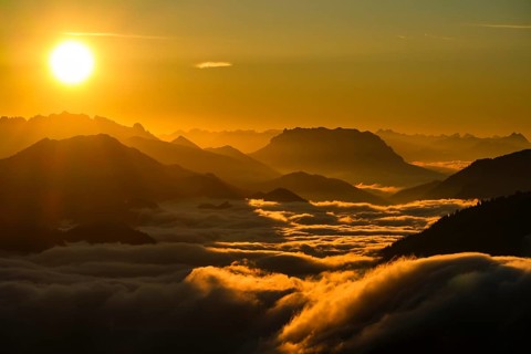 Silhouette of mountains at sunset, fog in valley, Wilder Kaiser and Chiemgau Alps, Upper Bavaria,