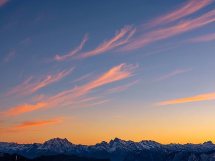 Red-colored plume clouds over the Berchtesgaden Alps at dusk, Hochstaufen, Chiemgau Alps, Upper