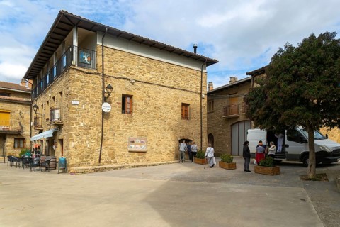 People buying bread from van shop, medieval village of Isuerre, Val d'Onsella, Zaragoza province,