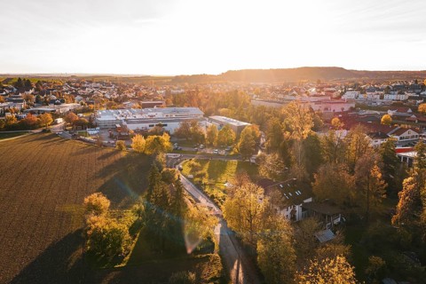 Landscape view at sunset with trees and urban buildings in autumn, Großbottwar, Germany
