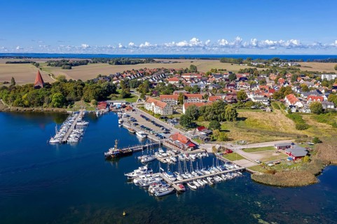 Aerial view over sailing boats in the harbour, marina of the village Kirchdorf in the Bay of