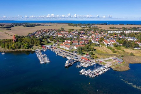 Aerial view over sailing boats in the harbour, marina of the village Kirchdorf in the Bay of