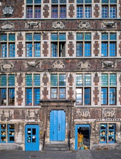 Façade of 17th century baroque guildhall Korenmetershuis at the Graslei in the city Ghent, East