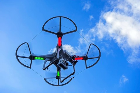 Miniature quadcopter drone, teleoperated unmanned aerial vehicle, UAV equipped with camera for