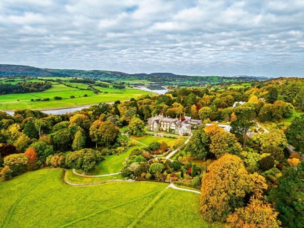 Autumn colours over Bodnant House and Garden from a drone, Conwy River, Colwyn Bay, Conwy, Wales,
