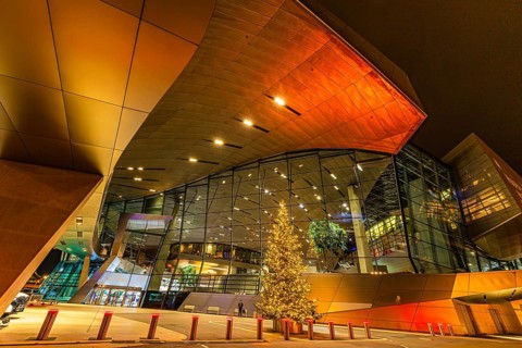 Illuminated Christmas tree in front of the colorful BMW world, Petuelring, Munich, Upper Bavaria,