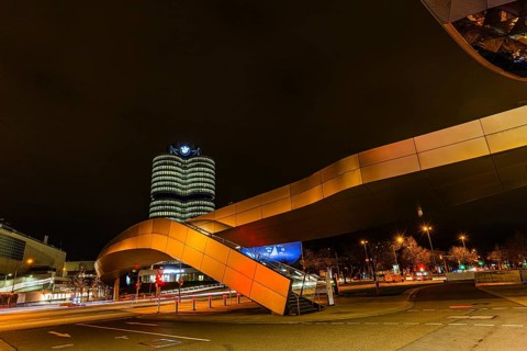 Federally illuminated BMW world, Petuelring, the BMW headquarters office tower in the back, Munich,