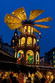 Christmas market with three-story illuminated Christmas pyramid, Rindermarkt, Munich, Upper