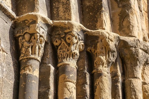 Stonework religious carvings, Iglesia del Salvador church, village of Luesia, Cinco Villas,
