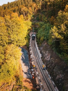 Autumn view of construction site from the air with tunnel boring machine and construction vehicles