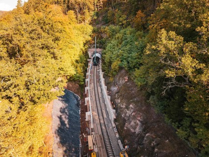 Aerial view of an autumn rail construction site in the forest, Hermann building, Hesse, railway,