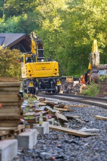 A construction site in the forest with construction machinery and rail works, construction of