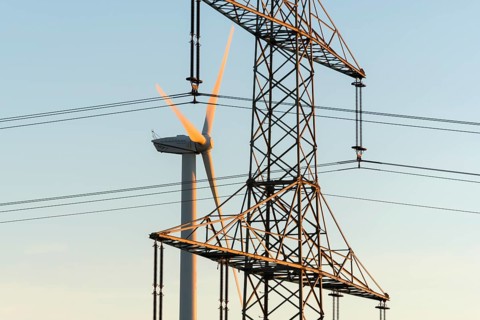 Wind turbine near power line, urban energy infrastructure, Swabian Alps, Baden-Württemberg, Germany