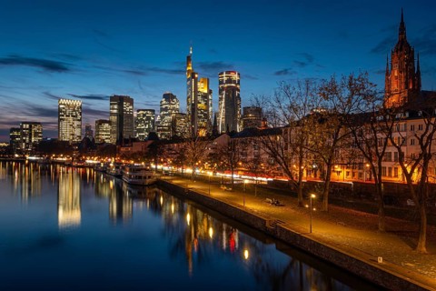 The Frankfurt banking skyline is reflected in the evening in the Main, Frankfurt am Main, Hesse,