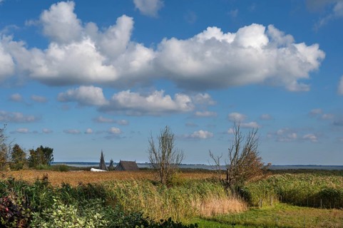 View of the lagoon with a strip of reeds and a fishing hut, Ahrenshoop, Darß, Mecklenburg-Western