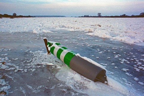 Buoy lying on ice rink, frozen Elbe, Bleckede, Lower Saxony, Germany, January 03, 1997, vintage,