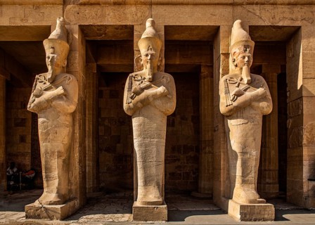 Hatshepsut's larger-than-life (5 m) Osiris statues in the middle colonnade, statues in the robe of
