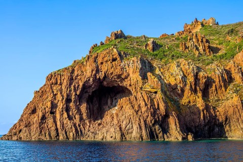 Rock formations and deep blue water in Scandola Nature Reserve, Corsica