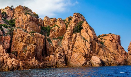Rock formations and deep blue water in Scandola Nature Reserve, Corsica, Corsica, France