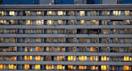 Prefabricated high-rise building with illuminated apartments on Alexanderplatz, Berlin, 05.11.2025,