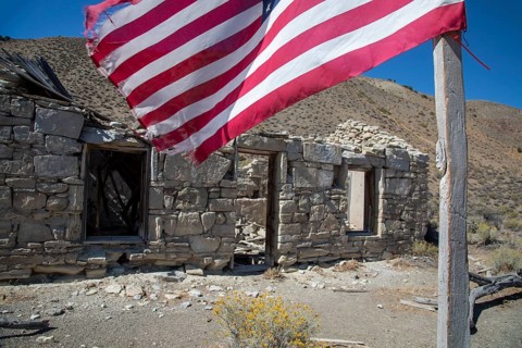 Austin, Nevada - A flag flies beside the ruins of the Walters station on the Nevada Central