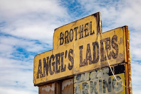 Beatty, Nevada - A sign for Angel's Ladies Brothel. Prostitution is legal in many parts of Nevada,