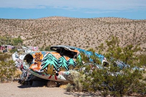 Beatty, Nevada - A decorated twin-engine airplane lies in the desert after a 1977 crash. The
