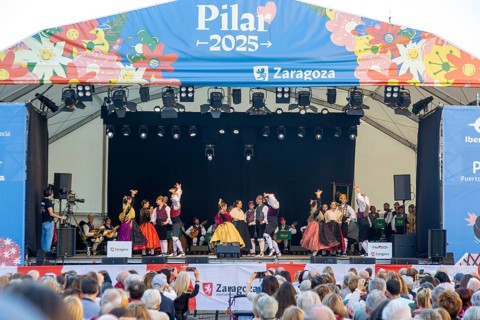 Folk dancers performing on stage as part of Pilar 2025 festival event, Zaragoza, Aragon, Spain