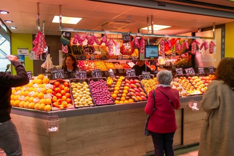 Market stall shop store selling fruit and vegetables inside Mercado Central de Zaragoza, Zaragoza,