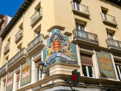 Historic Rived family crest on street corner of above pharmacy shop, Zaragoza, Aragon, Spain