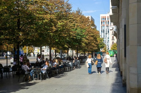 People sitting outside at street cafe near Plaza de Espana, Zaragoza, Aragon, Spain