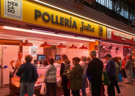 Market stall shop store selling chicken meat products inside Mercado Central de Zaragoza, Zaragoza,