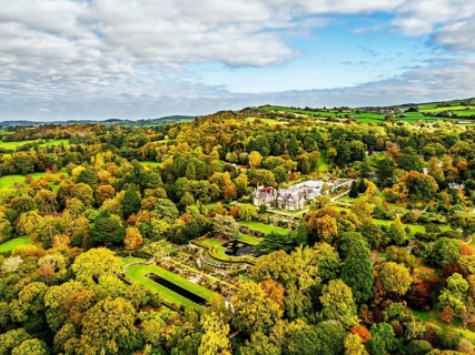 Autumn colours over Bodnant House and Garden from a drone, Conwy River, Colwyn Bay, Conwy, Wales,