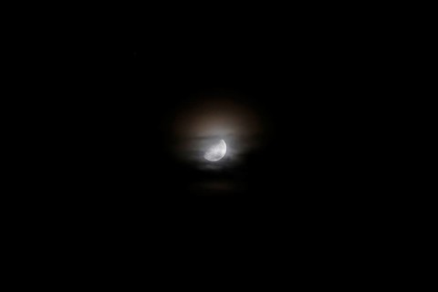 Moon at night behind veil clouds, autumn, Germany