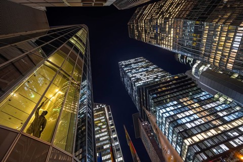 The lights of Frankfurt's banking skyline glow in the evening, Frankfurt, Hesse, Germany