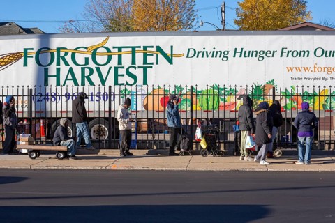 Detroit, Michigan USA - 4 November 2025 - People wait in line to pick up groceries from the
