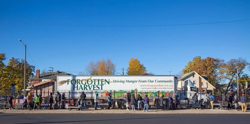 Detroit, Michigan USA - 4 November 2025 - People wait in line to pick up groceries from the