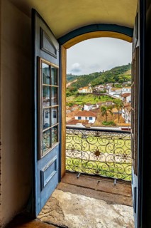 The city of Ouro Preto viewed through the doorway of one of its historic Baroque churches, Ouro