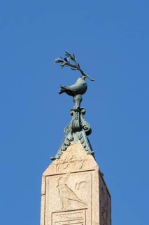 Peace dove bird sculture on the top of a building in the city of Rome, Italy