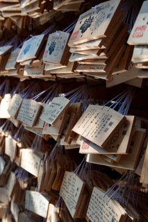 Ema, small wooden tablets with wishes and prayers, hung so that the Kami spirits or gods can