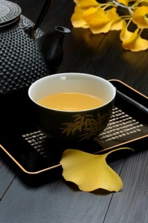 Ginkgo tea in tea bowl and ginkgo leaf, ginkgo biloba