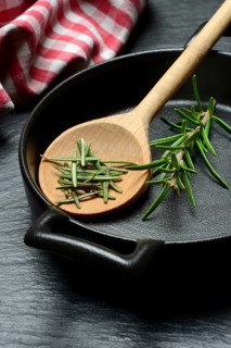 Rosemary, rosemary leaves and rosemary sprig with cooking pot