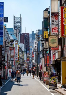 Lots of colorful signs of shops, restaurants and bars in a street, Shinjuku City, Tokyo, Japan