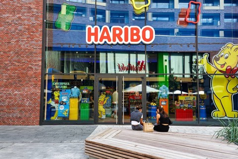 Glass façade, colorful shop window with Haribo lettering, Westfield Überseequartier, modern