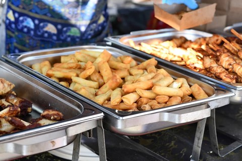 Fresh fried Thai spring rolls street food in chafing dish