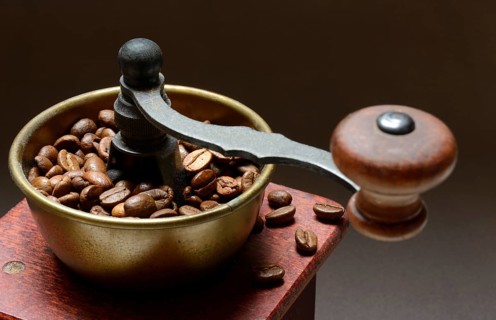 Coffee grinder with roasted coffee beans, grind coffee