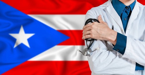 Puerto Rican healthcare concept. Doctor with stethoscope on Puerto Rico flag. Doctor holding