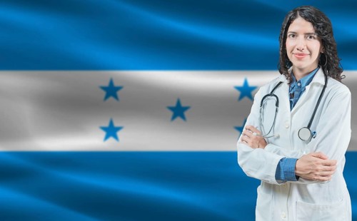 Honduran medicine and healthcare concept. Close up of doctor against Honduras flag background