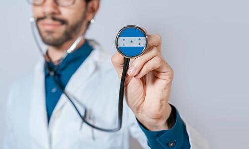 Doctor holding stethoscope with Honduras flag. Honduras health and care concept. Honduras flag on