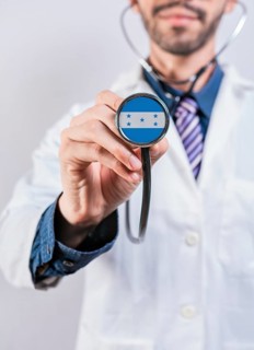 Honduras health and medical insurance concept. Honduras healthcare system, doctor holding